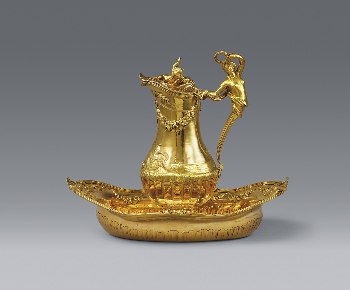 Jean-Baptiste François Chéret, Paris, 1770. Toiletry set for the Marquis and Marquise de Montmelas, silver with two-toned gold plating, h. of pitcher 29.5 cm/11.6 in, h. of basin 9 cm/3.5 in, l. 36.3 cm/14.3 in, d. 23.5 cm/9.3 in. Total weight 2,479 g/87.44 oz. Estimate: €1/1.2 M