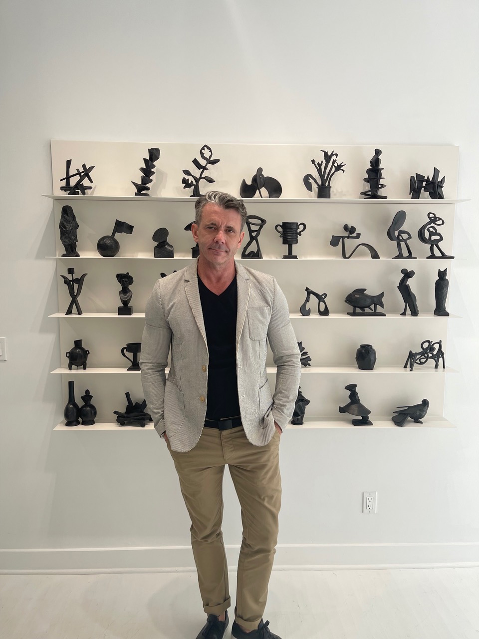 Denis Gardarin in front of William Kentridge’s Cursive (2020, bronze set of 40). Photograph by Justin Davy. Courtesy of the Artist and Goodman Gallery Johannesburg, Cape Town and London