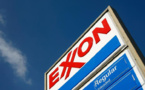 Exxon Mobil reduced profits, Chevron at a loss
